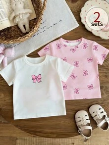 SHEIN 【两件套】甜美可爱粉色蝴蝶结印花圆领短袖T恤套装，适合6个月至2-3岁女童（纯色+全印花）。轻盈百搭的纯色套装，适合日常外出/校园穿着/生日派对/女宝宝节日活动，春夏秋季女宝宝服装，T恤套装 - 彩色 - 查看 3