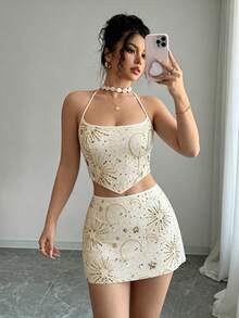 Qadelle Bộ đồ 2 mảnh phong cách lễ hội âm nhạc, nghỉ dưỡng biển dành cho nữ: Áo hai dây cổ yếm hở lưng ôm sát, chất liệu lưới thêu sequin, kết hợp với chân váy chữ A thắt eo. - Nhiều màu - Xem 6