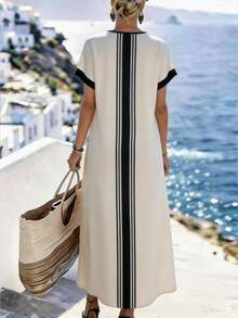 SHEIN Holidaya Đầm nữ mùa xuân/hè tối giản cổ chữ V kẻ sọc, thiết kế cổ chữ V + tay áo cánh dơi, kẻ sọc dọc đen trắng phía trước + họa tiết hình học tỏa tròn ở gấu đầm, gấu đầm đuôi cá bất đối xứng, chất liệu mềm mại, phù hợp cho công sở và các dịp thường ngày. Đặc điểm sản phẩm: Áo choàng in họa tiết hình học nữ, đầm cổ chữ V tay áo cánh dơi, đầm dáng suông bất đối xứng, đầm dài tối giản tương phản đen trắng, áo choàng công sở. - Màu be - Xem 2