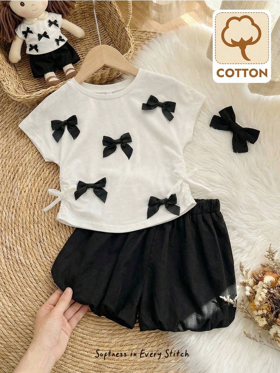 Cozy Pixies Conjunto de 2 piezas de top de manga corta con cuello redondo y decoración de lazo, y shorts de cintura elástica en bloques de color para niña bebé, conjunto casual para vacaciones - Blanco y Negro - Ver 1