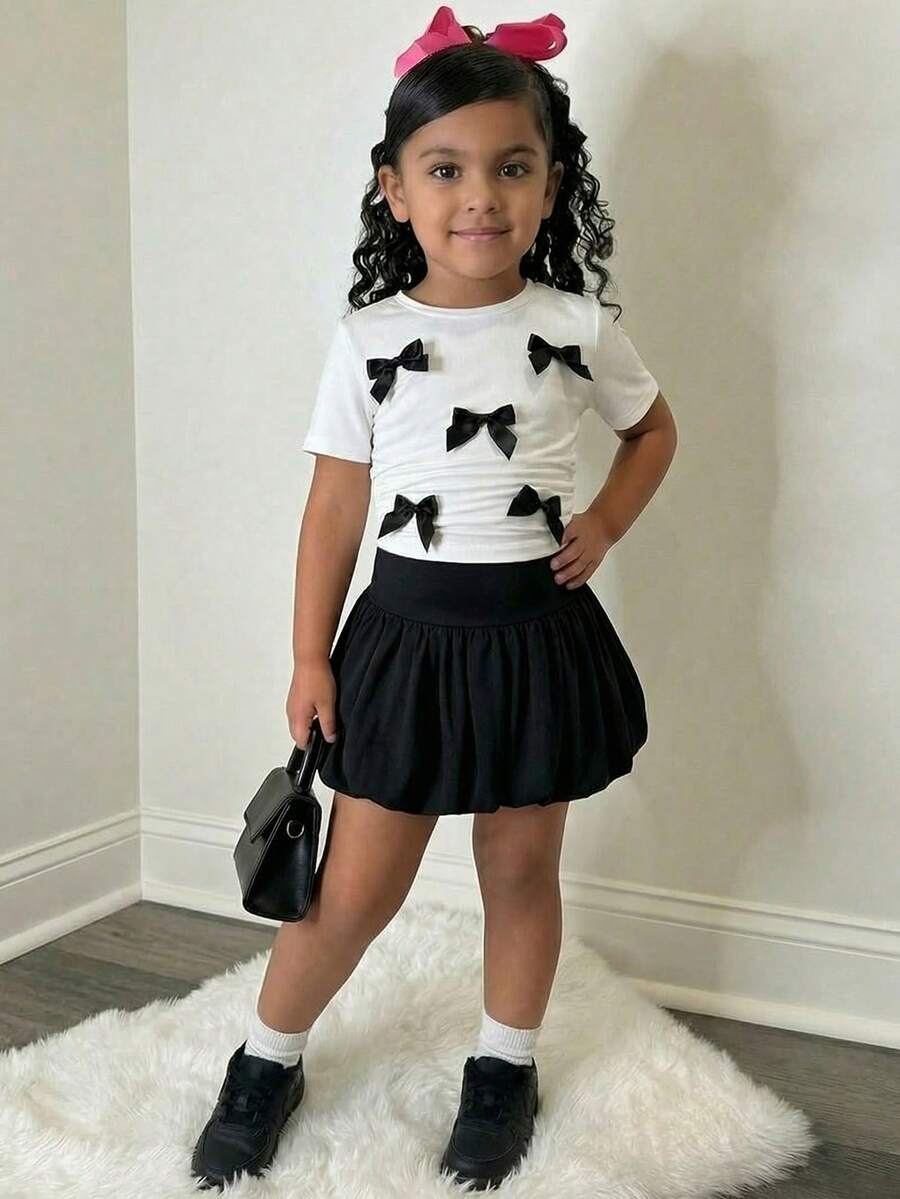 Set de 2 piezas de blusa de punto con lazo en contraste negro y blanco y falda con volantes para niñas jóvenes, conjunto casual de uso diario, adecuado para salidas, campamentos, sesiones de fotos - Blanco y Negro - Ver 1