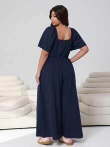 Solflare 2026春夏新款休闲日常穿搭，适合派对、约会、生日、音乐节、返校、通勤、度假等多种场合。荷叶边短袖连体裤，露肩设计，柔软棉混纺面料，宽松版型，长款，黑色，大码可选。 - 藏蓝色 - 查看 2