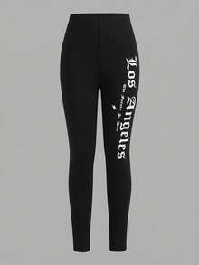 Bộ đồ thường ngày cho bé gái tuổi teen: Áo thun trắng in chữ xanh và quần legging xanh. - Đen và trắng - Xem 7