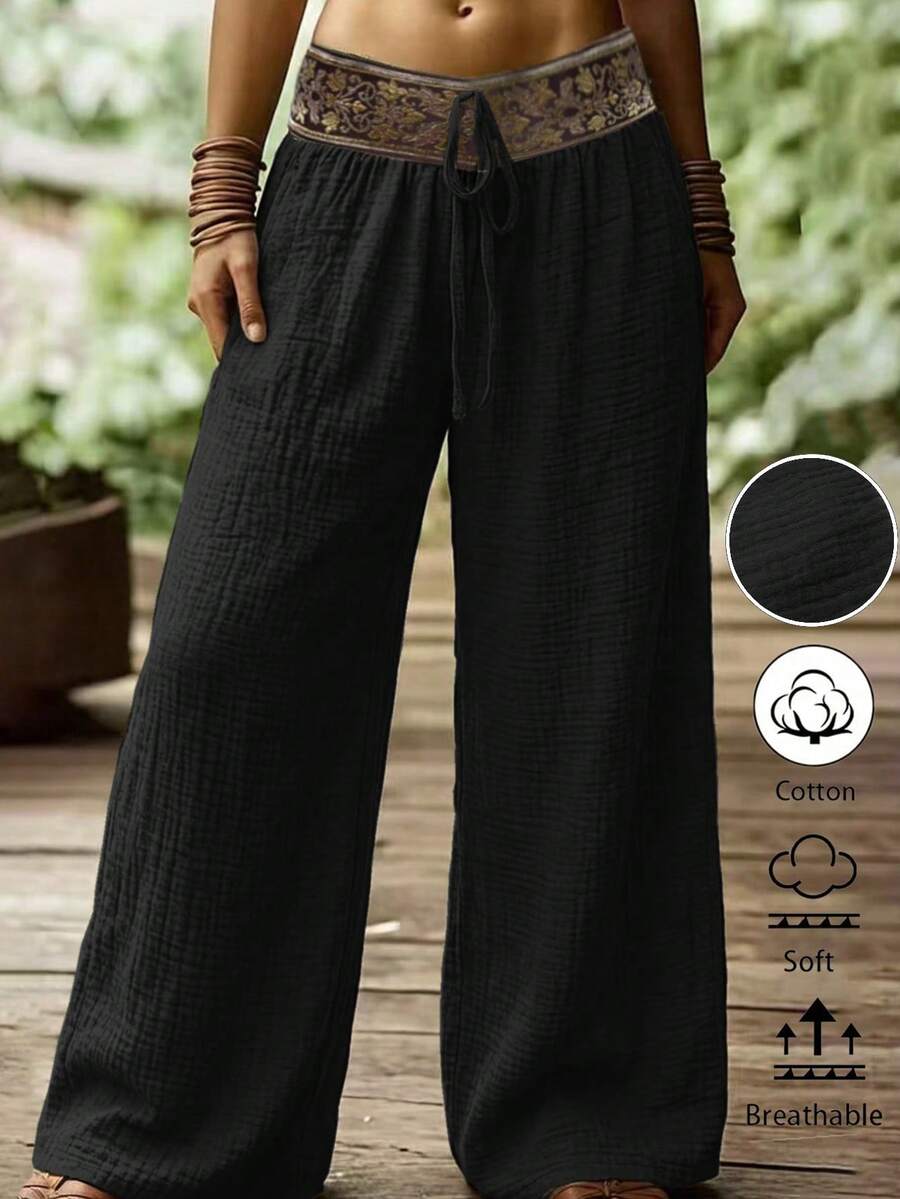 Zayélia Blommiga byxor med dragsko i midjan och vida ben, minimalistiska - Svart - Visa 1