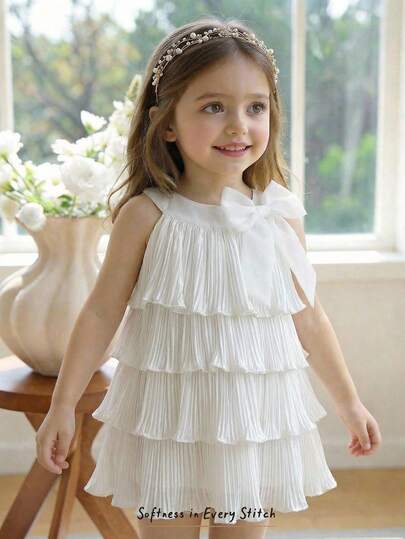 Cozy Pixies Đầm dạ hội xếp ly nhiều lớp màu trơn, kiểu dáng thời trang mùa hè cho bé gái, thích hợp đi nghỉ mát ở bãi biển, điểm nhấn là nơ trang trí.