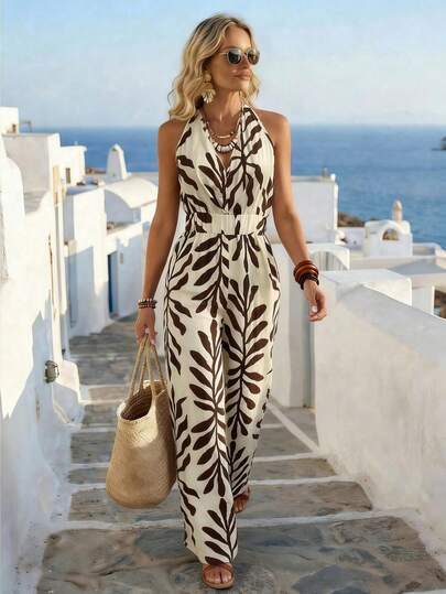 Breezaya Mono elegante de mujer con cuello halter, con diseño de escote en V y cintura alta, hecho de tela con estampado de hojas tropicales, adecuado para vacaciones, playa u ocasiones casuales. Aspectos destacados del producto: Mono de estilo resort para mujer con cuello halter, pantalones anchos con elegante estampado botánico, mono con cintura ceñida, pantalones de corte relajado y con estilo, mono beige-marrón retro.