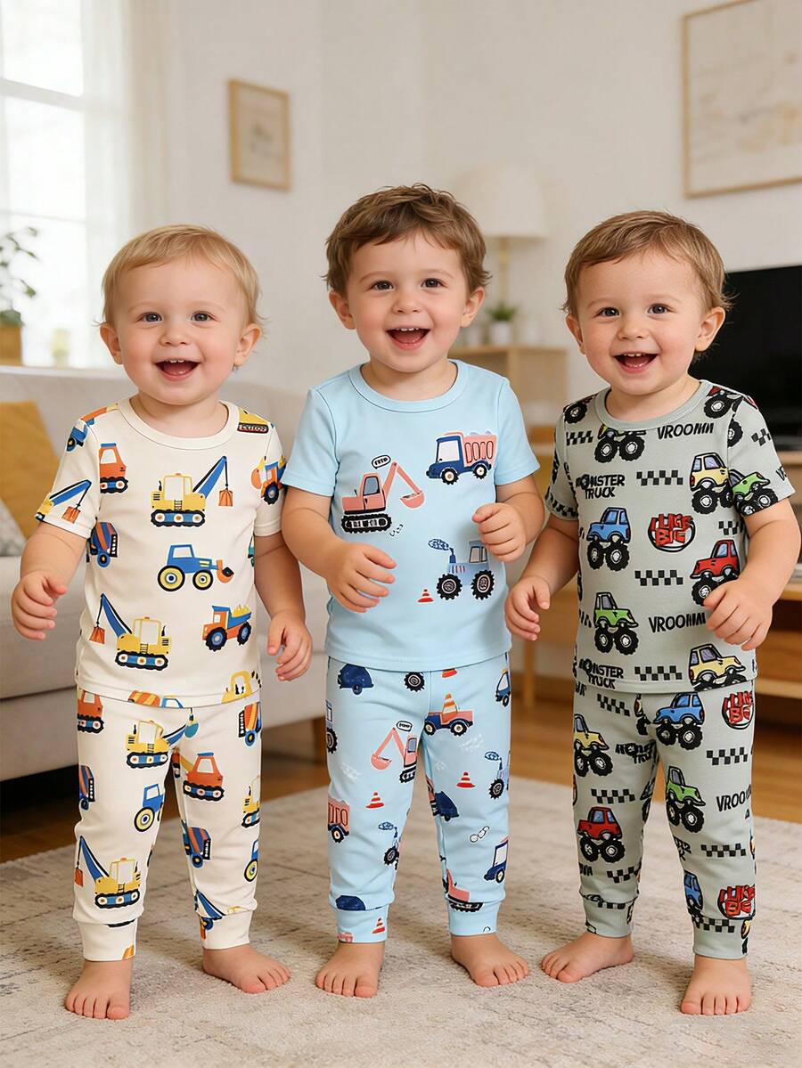 Conjunto de 6 piezas de ropa de dormir ajustada para niños pequeños, pijamas de cuello redondo de manga corta con gráficos de vehículos de construcción de dibujos animados multicolores en tela de punto suave y ligera. Este patrón vibrante en verde claro, crema y azul claro es ideal para el uso diario de ropa de dormir y ropa de estar cómoda en primavera y verano. - Multicolor - Ver 1