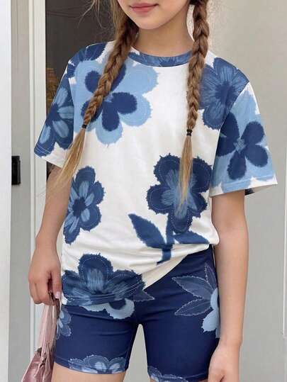 SHEIN Explorewe Bộ 2 món cho bé gái tuổi teen, gồm áo thun tay ngắn dáng rộng in hoa và quần short bó sát, trang phục mùa hè.