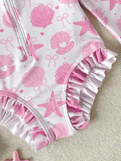 SHEIN Bộ đồ bơi dài tay in hình vỏ sò màu hồng cho bé gái (kèm mũ), bộ đồ bơi cho bé gái, trang phục đi biển cho bé gái, bộ đồ bơi dài tay đi biển thích hợp cho kỳ nghỉ, bộ đồ bơi cổ tròn có khóa kéo mùa hè.