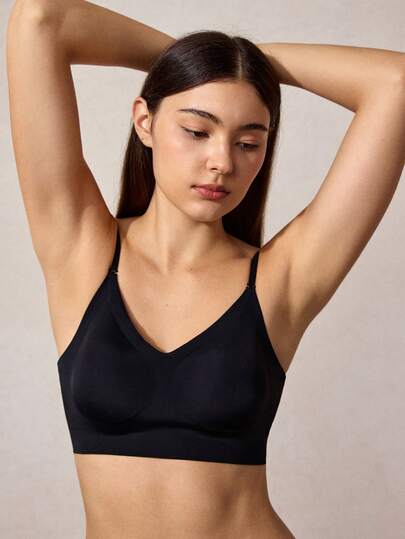 黑色基础款T恤文胸，无背带设计，带可拆卸胸垫和无钢圈，舒适无缝，轻松打造各种造型。