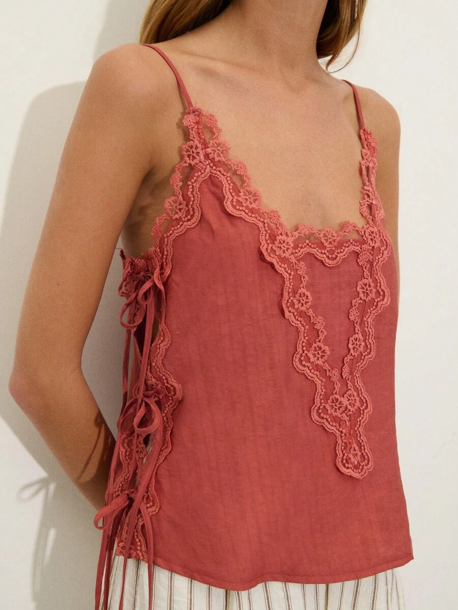 Nöista Terracotta Top With Ornate Lace Trim Along The Neckline And Center Panel. Adjustable Side Tie Details With Customizable Fit. Perfect For Date Nights, Spring, Summer, Holiday Vacation Look. - Coral Orange - View 1