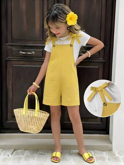 SHEIN Đây là một chiếc váy liền thân dành cho bé gái tuổi teen, có dây đeo vai rộng và một chiếc nơ lớn trên vai. Chiếc váy có dây đeo vai rộng rãi, phù hợp cho các bé gái mặc trong những dịp thường ngày vào mùa hè.