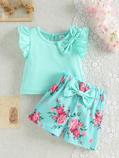 SHEIN 2 piezas Conjunto de ropa casual y elegante para niña bebé, blusa con mangas abullonadas y decoración de moño, y shorts con estampado floral, para primavera/verano