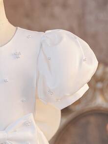 Glamorique Kids Girls' White Sleeveless Beaded Bow Decor Party Dress, Children's Birthday Wedding Flower Girl Dress, Minimalist Elegant Princess Gown For Party White Bow Dress Girls Elegant White Dress Disneyland Flower Girl Princess Dress White Baptism Dress With Pearls Sparklyn Short Sleeve Girls Dress Little Sister Girl White Elegant Dress White Pearl Dress Communion White Flower Girl Dress Girls Dress Short Sleeve - Beige - View 6