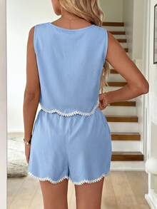 Bộ đồ nữ gồm áo không tay và quần short màu trơn, viền bèo nhún, thêu hoa, thích hợp cho kỳ nghỉ hè và mặc hàng ngày. - Màu xanh nhạt - Xem 8