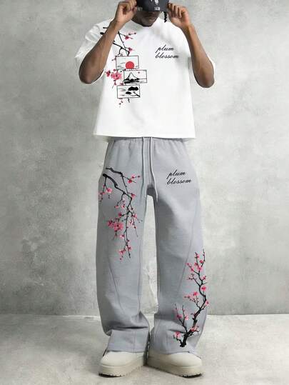 Manfinity EMRG Bộ đồ nam thường ngày gồm áo thun ngắn tay in chữ và hoa, quần short.