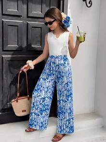 Sparklyn 白色无袖圆领背心搭配彩虹色褶皱阔腿裤，是一套简约时尚的春夏通勤装扮，无论是工作还是休闲都非常合适。 - 彩色 - 查看 6