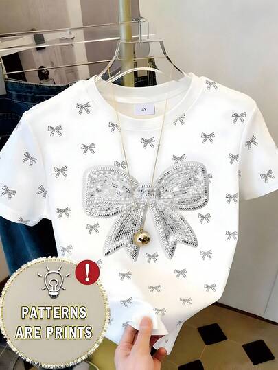 女童时尚简约可爱亮片蝴蝶结印花圆领短袖T恤，适合夏季外出穿着，白色蝴蝶结上衣
