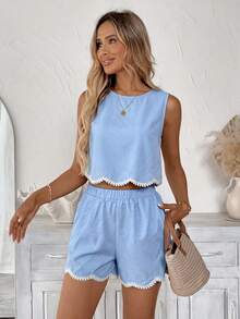 Bộ đồ nữ gồm áo không tay và quần short màu trơn, viền bèo nhún, thêu hoa, thích hợp cho kỳ nghỉ hè và mặc hàng ngày. - Màu xanh nhạt - Xem 4