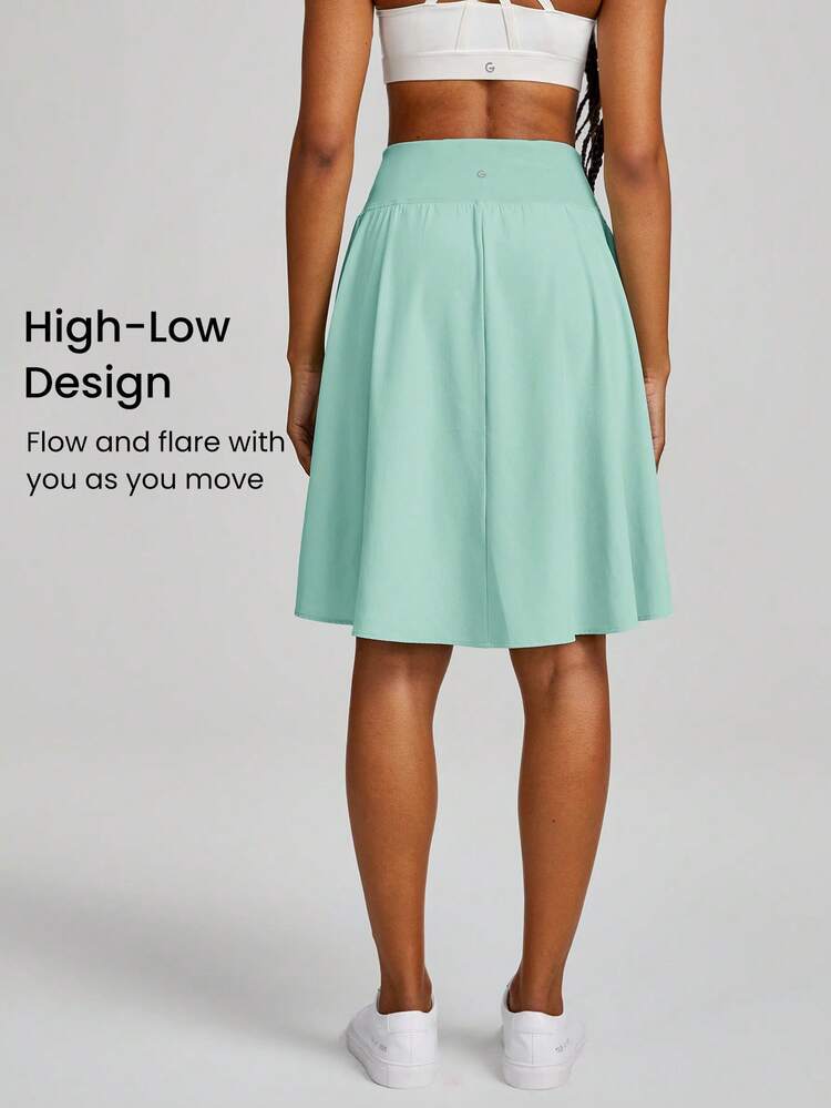 Falda cruzada con bolsillo y dobladillo alto-bajo VitalSwift con pantalón corto incorporado, soporte ligero de impacto bajo para uso casual diario