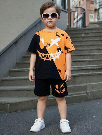 SHEIN Bubblio Bộ đồ 2 mảnh thoải mái, năng động dành cho bé trai, gồm áo thun ngắn tay cổ tròn và quần short, in hình hoạt hình mặt cười, chất liệu mềm mại, thích hợp mặc hàng ngày, đi chơi, hoạt động ngoài trời, kỳ nghỉ, tiệc tùng, kỳ nghỉ hè, mùa xuân/hè.