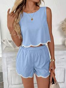 Bộ đồ nữ gồm áo không tay và quần short màu trơn, viền bèo nhún, thêu hoa, thích hợp cho kỳ nghỉ hè và mặc hàng ngày. - Màu xanh nhạt - Xem 9