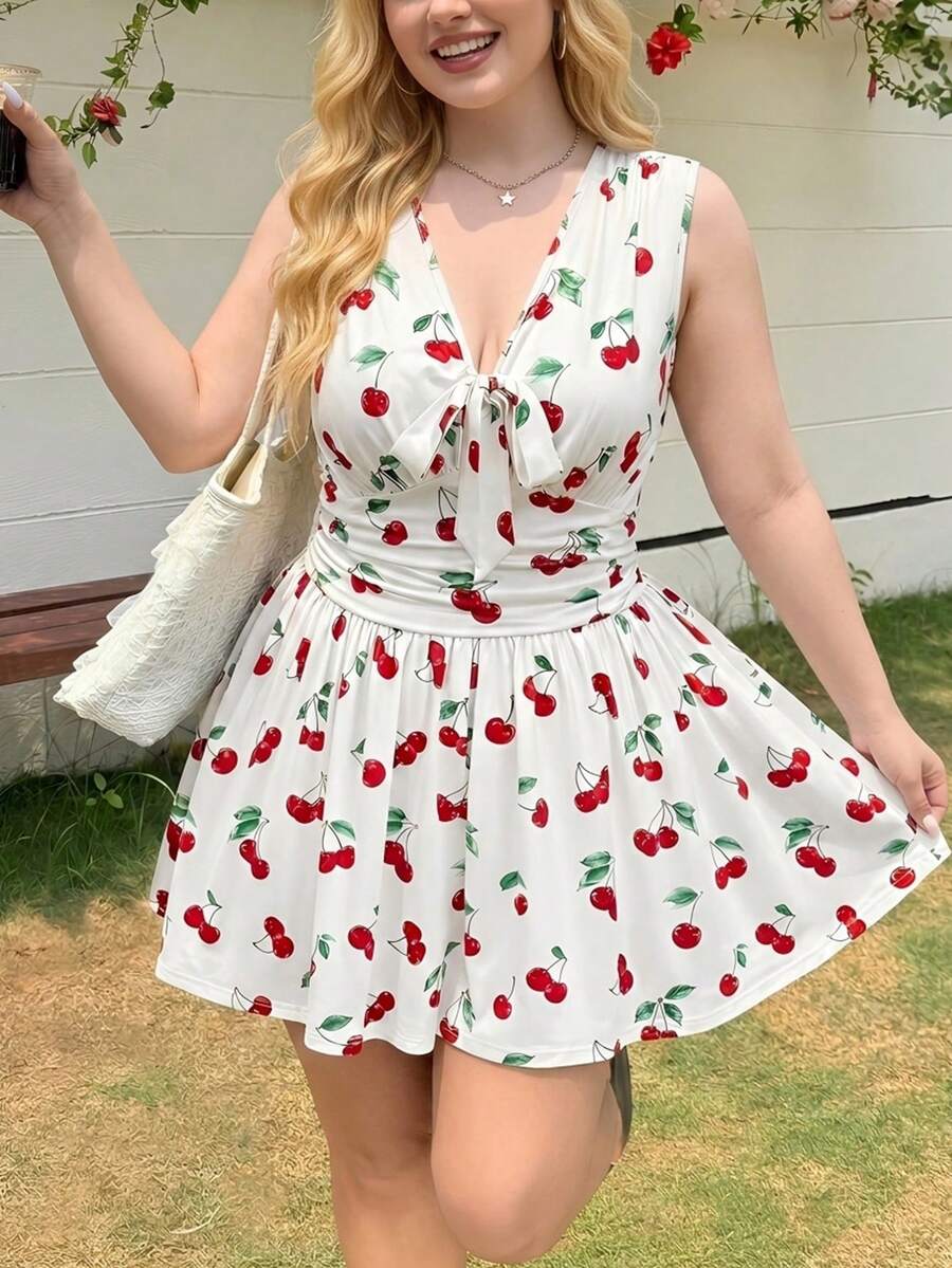 SHEIN MOD Bộ jumpsuit ngắn màu trắng ngà, cổ chữ V, eo nhún, họa tiết hoa anh đào, trang trí nơ phía trước, thích hợp cho kỳ nghỉ, mặc thường ngày, cỡ lớn.