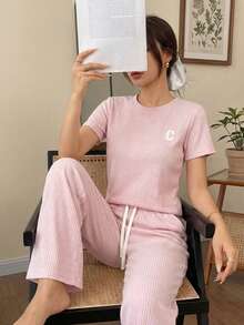 Conjunto casual de dos piezas acanalado: camiseta manga corta y pantalón amplio con cordón, Conjunto loungewear acanalado negro: camiseta relaxed fit y pantalón wide leg, Set cómodo acanalado 2 piezas: top básico + pantalón holgado con cintura ajustable - Rosa - Ver 3