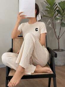 Conjunto casual de dos piezas acanalado: camiseta manga corta y pantalón amplio con cordón, Conjunto loungewear acanalado negro: camiseta relaxed fit y pantalón wide leg, Set cómodo acanalado 2 piezas: top básico + pantalón holgado con cintura ajustable - Beis - Ver 3