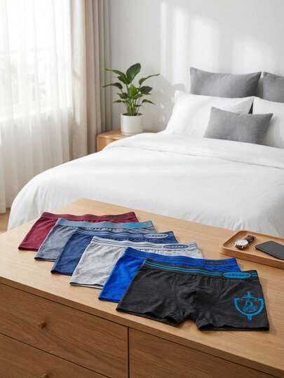 Paquete de 12 piezas de bóxers tipo brief para hombre de microfibra, con diseños aleatorios. El envío puede variar debido a la alta demanda.