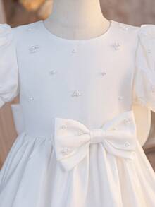 Glamorique Kids Girls' White Sleeveless Beaded Bow Decor Party Dress, Children's Birthday Wedding Flower Girl Dress, Minimalist Elegant Princess Gown For Party White Bow Dress Girls Elegant White Dress Disneyland Flower Girl Princess Dress White Baptism Dress With Pearls Sparklyn Short Sleeve Girls Dress Little Sister Girl White Elegant Dress White Pearl Dress Communion White Flower Girl Dress Girls Dress Short Sleeve - Beige - View 3