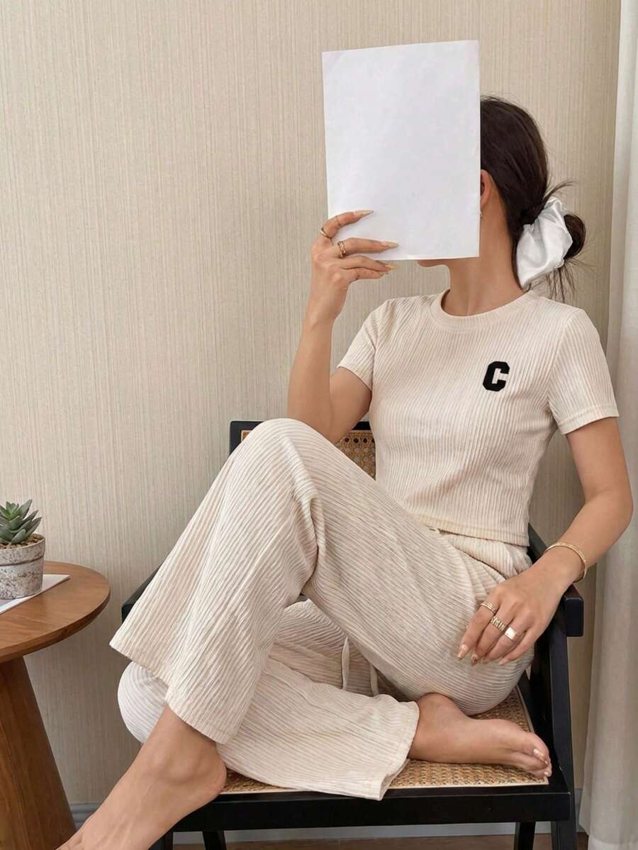 Conjunto casual de dos piezas acanalado: camiseta manga corta y pantalón amplio con cordón, Conjunto loungewear acanalado negro: camiseta relaxed fit y pantalón wide leg, Set cómodo acanalado 2 piezas: top básico + pantalón holgado con cintura ajustable - Blanco - Ver 1