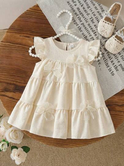 SHEIN Vintaside Kids Vestido de estilo pastoril para niñas pequeñas, de tela suave, con decoración de lazo, mangas de vuelo, lindo y de moda, versátil para primavera y verano