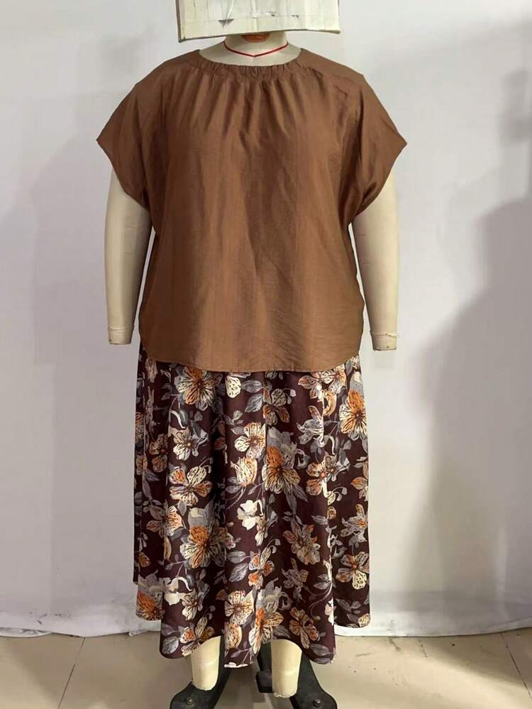 Plus Size Solid Color Minimalist Daily Wear Round Neck Top & Printed Skirt 2-Piece Set,Brown 2pc Set Plus Size Women's Summer Casual Vacation Country Solid Color Loose Top And Floral Print Skirt 2 Piece Set,Early Spring,Spring Break Outfits ,Vacation Outfits Women ,Holiday Outfits For Women,Going Out Outfits,2026 New Clothes,Simple And Fashionable For Everyday Wear, Summer Skirt Sets, Summer Outfit Set For Women, Skirts Sets