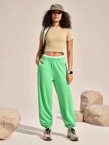 Exploreva Pantalones jogger para mujer con cintura elástica, bolsillos en diagonal y ribete de contraste - Verde - Ver 1