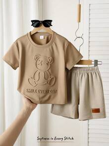 Cozy Pixies Bộ 2 món cho bé trai, gồm áo tay ngắn cổ tròn in hình gấu và quần short cạp chun, thích hợp cho các hoạt động giải trí, thể thao, dã ngoại, vui chơi, phong cách đường phố, tiệc tùng, kỳ nghỉ, bãi biển và nhiều dịp khác. - Nhiều màu - Xem 4