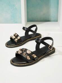 Mini mi #OceanCharm Sandalias planas negras de PU con doble correa, decoración de conchas y estrellas de mar para niñas - Suela con ribete dorado, elegante y lista para el verano - Negro - Ver 7