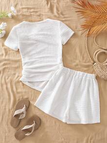 SHEIN Conjunto de camiseta de manga corta asimétrica blanca de diseñador para adolescentes (niñas) con cuello en ángulo, cintura con volantes y hebilla de metal. Adecuado para usar en primavera y verano. El diseño único del cuello en ángulo y la cintura con volantes lo hacen apropiado para el uso diario, fiestas, escuela y otras ocasiones. - Blanco - Ver 5