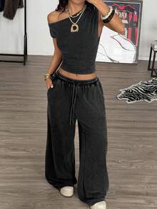 Muchica Bộ đồ thể thao gồm áo dệt kim màu đen dáng ôm sát vai bất đối xứng và quần ống rộng cạp chun có dây rút. - màu đen - Xem 6