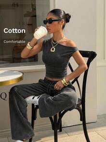 Muchica Bộ đồ thể thao gồm áo dệt kim màu đen dáng ôm sát vai bất đối xứng và quần ống rộng cạp chun có dây rút. - màu đen - Xem 7