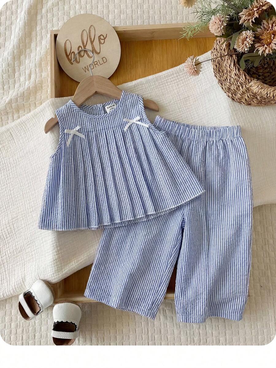 Bộ đồ bé gái dễ thương cho kỳ nghỉ hè, gồm áo hai dây kẻ sọc xanh trắng và quần ống rộng cạp chun có dây rút. - Màu xanh lam - Xem 1