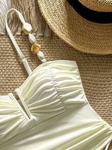 Swim Chiccia Bộ bikini 2 mảnh gồm áo tankini dài xếp ly và quần tam giác xếp ly, chất liệu vải đá mịn, thanh lịch. - Màu be - Xem 2