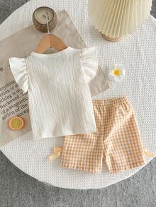 SHEIN Set di maglietta a maniche corte con fiori 3D e pantaloncini a quadri per bambine - Giallo - Visualizzare 2