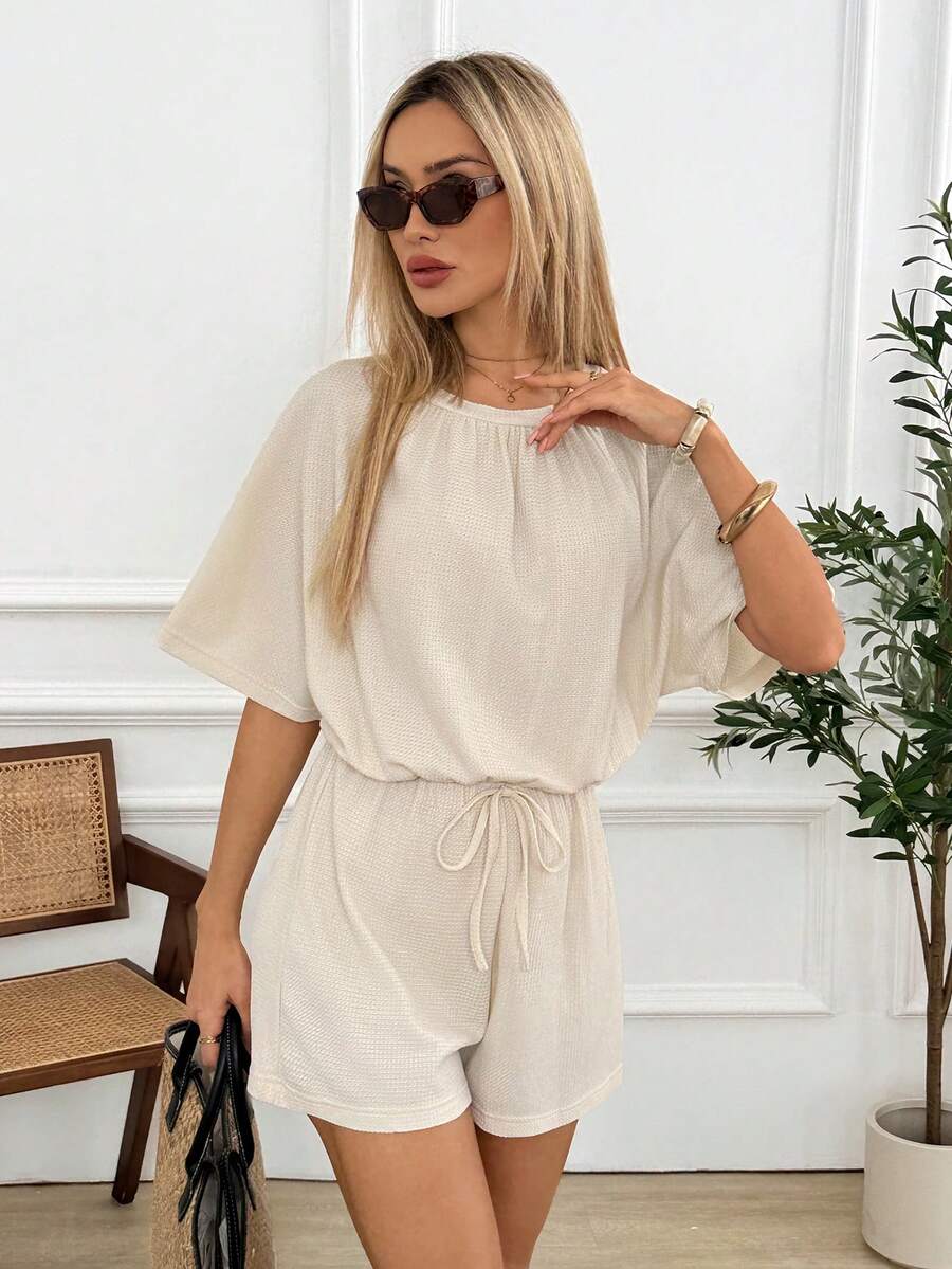 Easowa Combinaison femme col rond couleur unie, manches courtes, taille nouée - Blanc - Voir 1