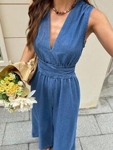 Serisse 女士夏季休闲V领收腰无袖牛仔连体裤，适合夏季嘉年华、通勤、度假、毕业典礼等场合，时尚百搭，充满Y2K风格，可爱街头风，适合派对、婚礼、商务休闲、海滩、毕业典礼等各种场合。这款时尚女士牛仔无袖连体裤采用V领设计，配有松紧腰带和阔腿裤腿，适合日常穿着。 - 藍色 - 查看 1