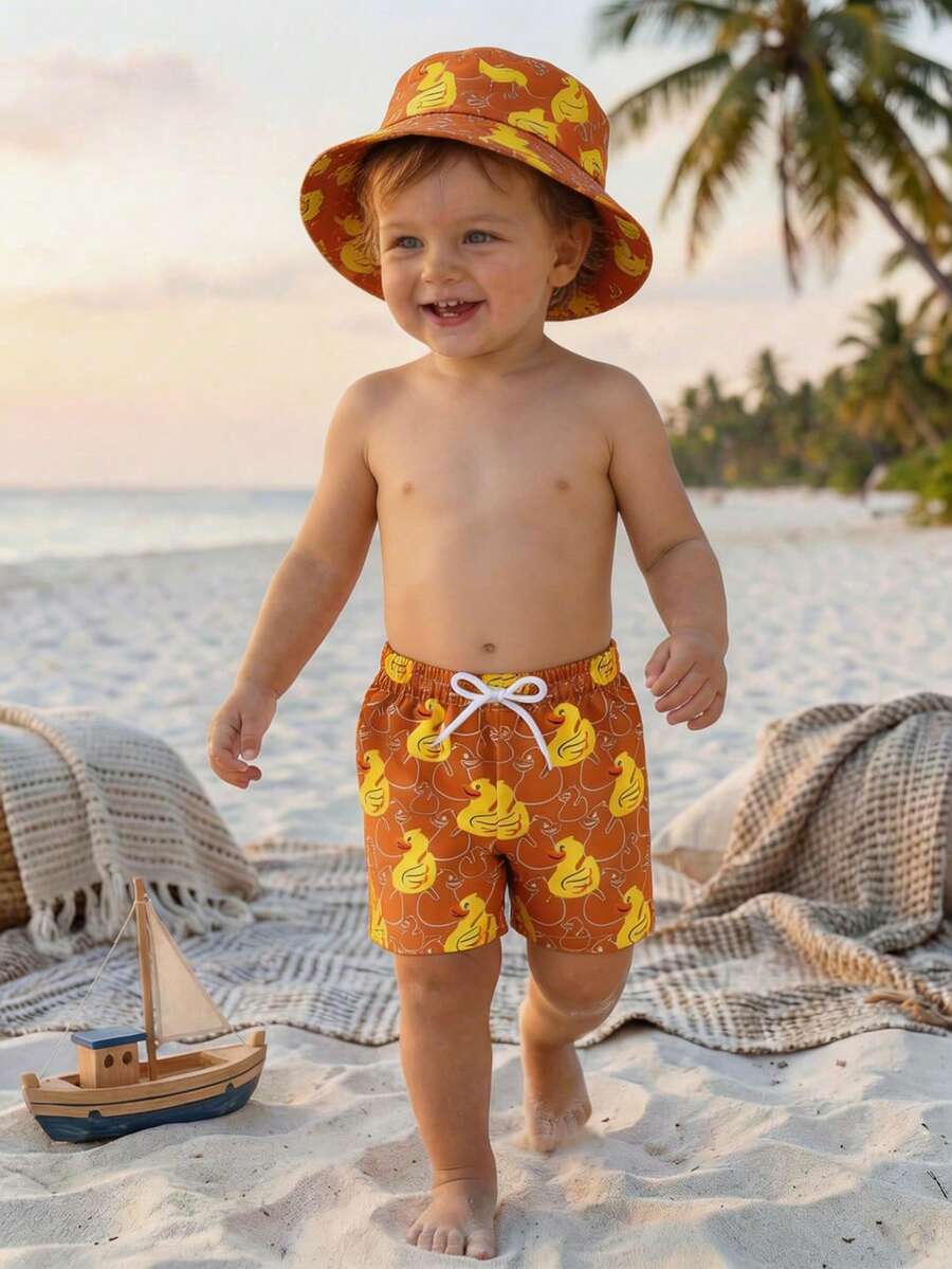 SHEIN Quần bơi trẻ em trai in hình vịt hoạt hình, có dây buộc eo và mũ. - trái cam - Xem 1