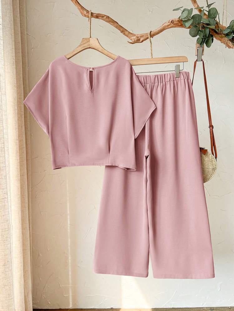 Plus Size Women's Spring Casual Vacation Round Neck Short Sleeve Solid Color Cropped Top And Pants 2-Piece Set,Plus Size Women's Spring/Summer Casual Vacation Round Neck Short Sleeve Solid Color Cropped Top And Pants 2-Piece Set ,Nude Two Piece Set Two Piece Set ,Women Comfy Modest Two Piece Set ,Beige Two Piece Set, Comfortable Two Piece Set,Early Spring,Spring Break Outfits ,Vacation Outfits Women ,Holiday Outfits For Women,Spring Clothes Women,Going Out Outfits,2026 New Clothes,Simple And Fashionable For Everyday Wear, Two Piece Set Women Comfy,Pink Set,Gifts For Mother