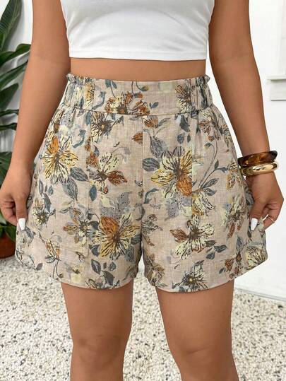 SHEIN Frenchy Quần short nữ cỡ lớn cạp cao, có bèo nhún, túi, in họa tiết hoa, kiểu dáng rộng rãi thoải mái.