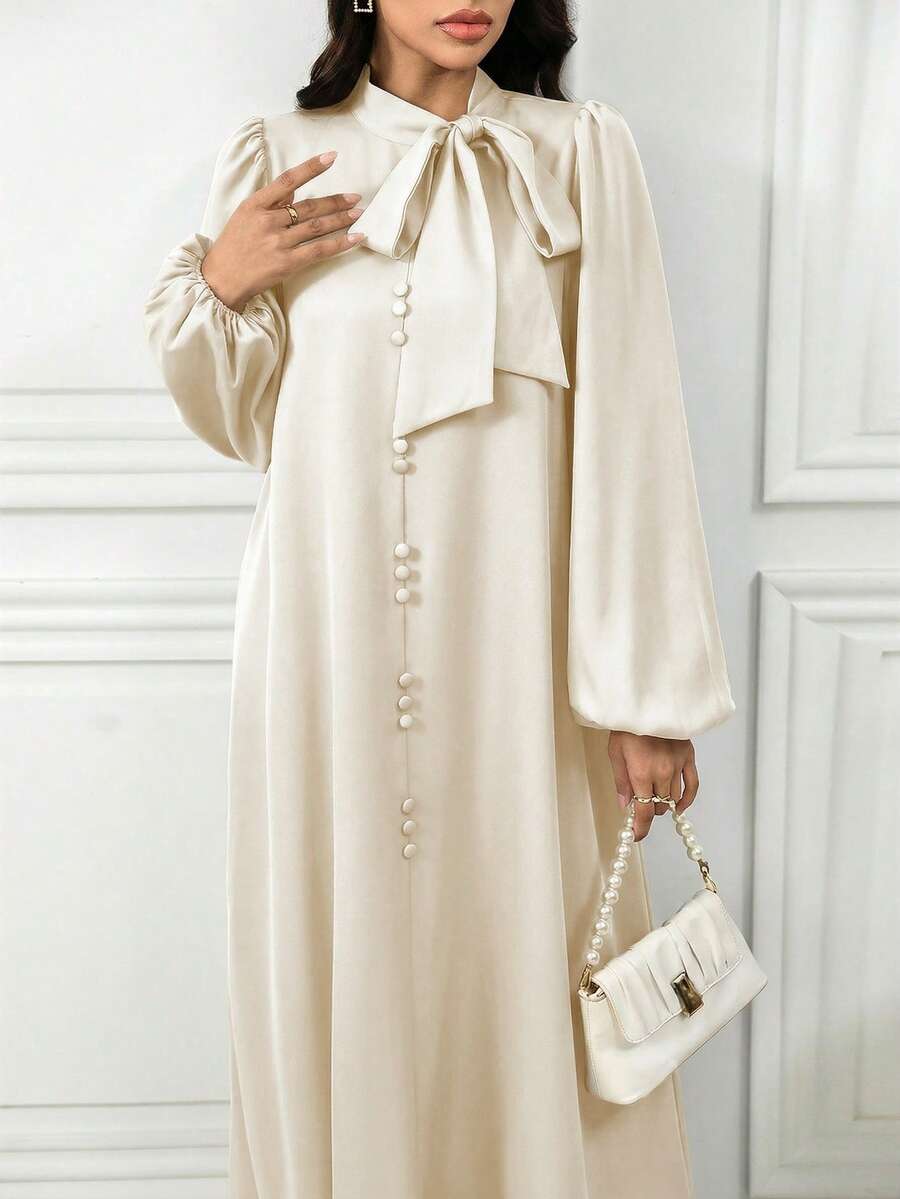Al Najma 女士优雅纯色灯笼袖系带领阿拉伯连衣裙,适合秋季穿着,款式端庄优雅,A字型设计,适合日常休闲穿着。 - 米色 - 查看 1