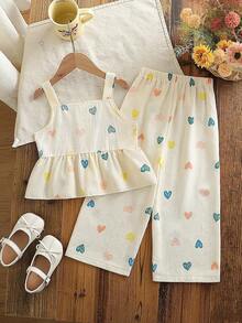 SHEIN Genkimix Kids Conjunto de 2 piezas de estilo europeo y americano para niñas en verano, con top de tirantes con estampado de corazones + pantalones de pierna ancha, de tela de algodón con textura de burbujas, suave y agradable a la piel, apropiado para niñas de 4 a 7 años, adecuado para jugar al aire libre - Albaricoque - Ver 3